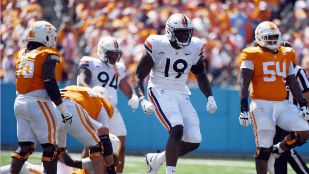 Virginia Cavaliers defensive tackle Olasunkonmi Agunloye (19) celebrates after a sack during the first half against the Tennessee Volunteers at Nissan Stadium.
